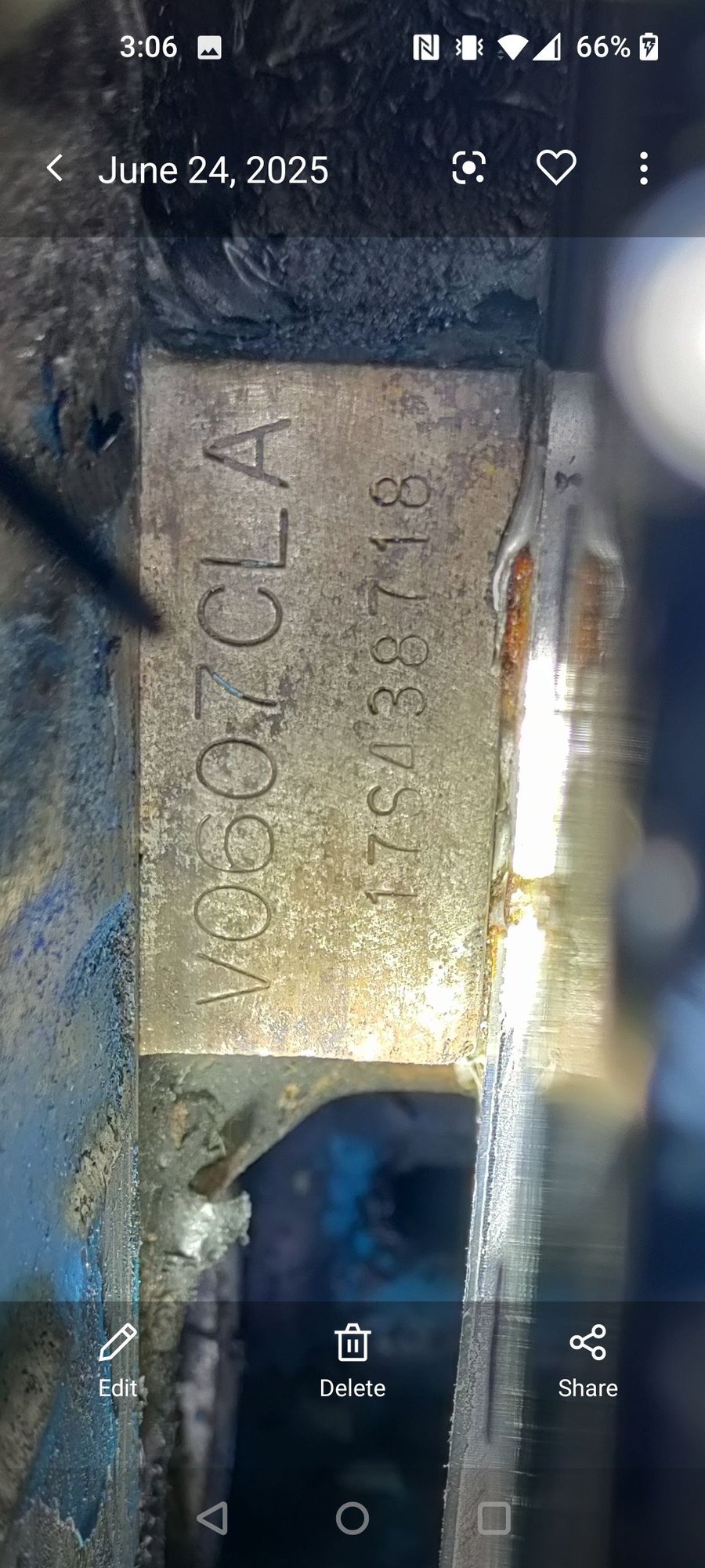 Front of motor behind AC compressor on passenger side 
