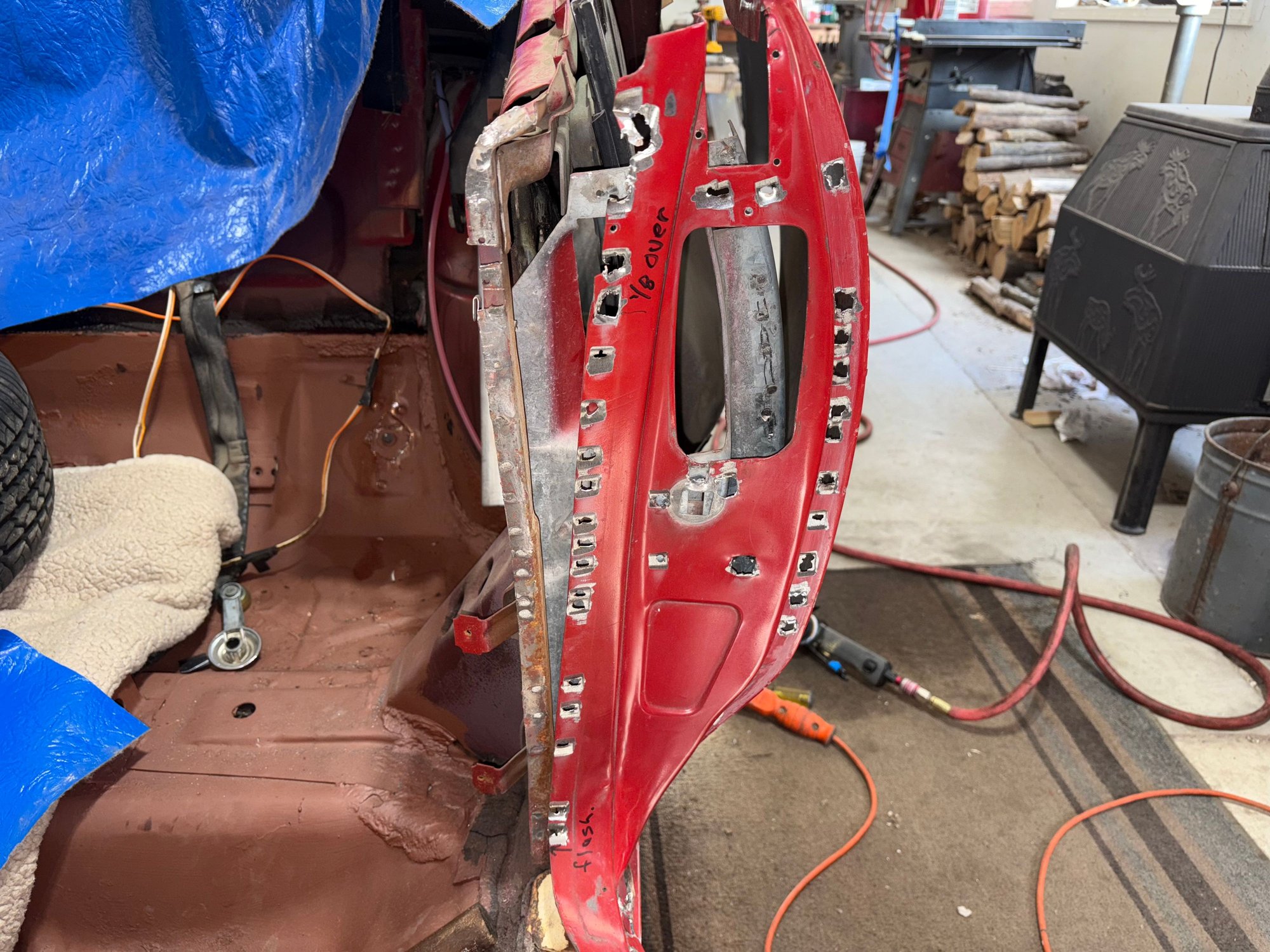 Lots of spot welds in the door jamb area.  I missed several around the door strike stud, and had to go back and get them.