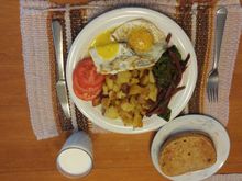 No idea why it uploads upside down. Taters with sausage,mater's, cackleberries, beet tops toast and milk. Yeah, I know it's a poor substitute for beer 😀