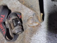 Interior bolt head securing the belt