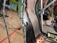 I used the divot marks from the spot weld drill bit to help realign the brace to the the outer fender then plug welded the holes.