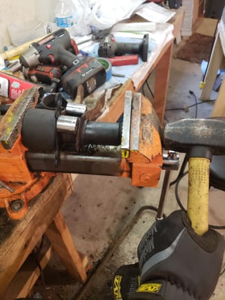 I found that the bushing tools i used on the front did not work as well as the front.  I ended up using the drill bit method pointed out to me by a member here to get the rubber out.  Then I used a socket in the vice and a hammer. Tighten, hit, tighten, hit and it came right out.