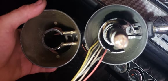 Left is from the car i am currently working on appears to be missing the spring that goes under the shift lever. Right it from my other car I was trying to figure out how it is supposed to be. 