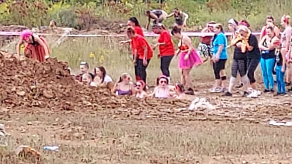 Daughter in the purple top down in the 1st mud pit, my wife immediately to her right.