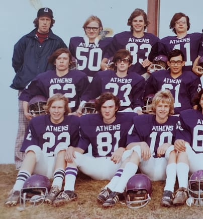 Dad coaching JV football in the fall of '74.  I'm #22 in the lower left.