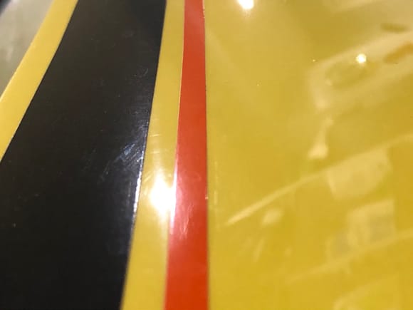 Original stripes on my car - separate, color all the way through. Smooth finish. 