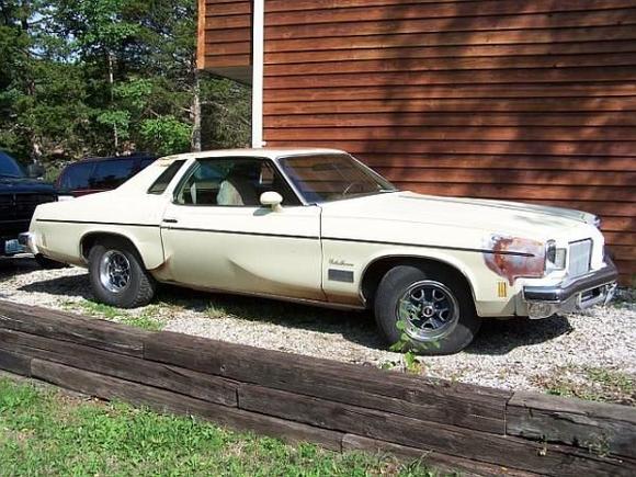 Cutlass on side of house