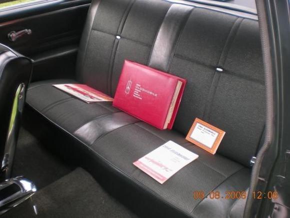 Rear seat with dealer album and some of the documentation