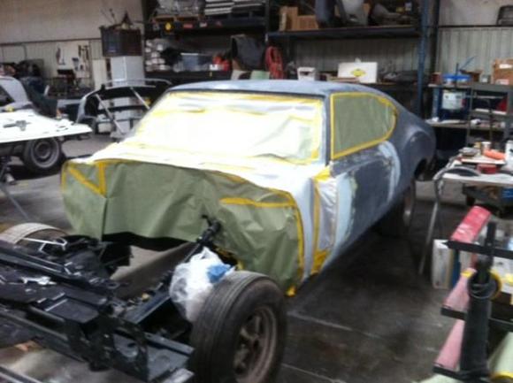 3.24.12Getting her taped up for ashower of primer.First time in 32 years the car will ne one color