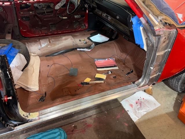 I used Jasco stripper and a stainless steel welding brush to remove the old red paint, and what looked to be maybe one coat of lacquer primer?  