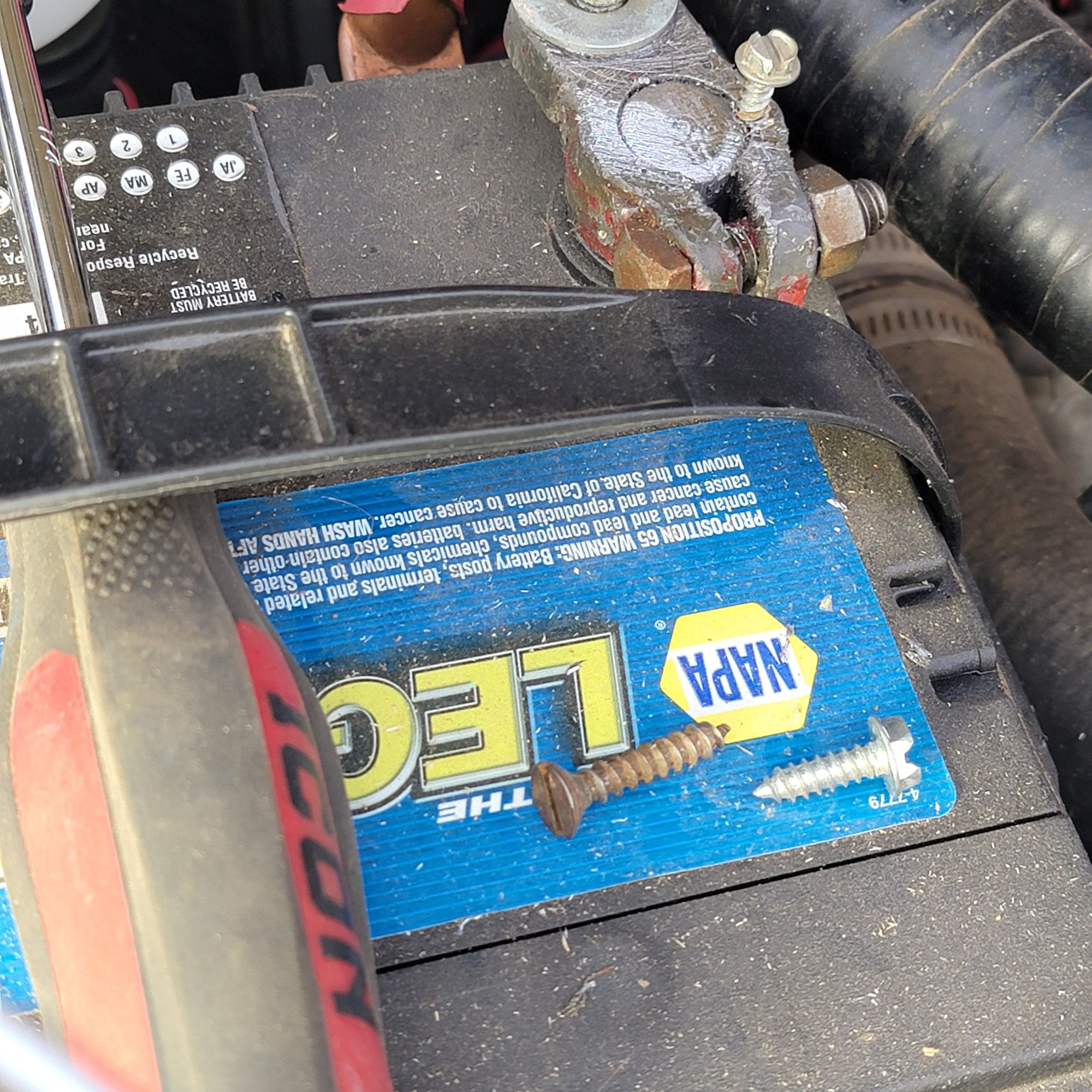 If you have a gap between the clamp and post, this can work. the 2 screws on the blu are #10s, too large the other is a #6 sheet metal screw. Or even better a #4.  And this can cut thru any corrosion that can be present, like the dark gray hard stuff that a brush wont touch. Most people wont like the screw, remember, its for troubleshooting the problem!