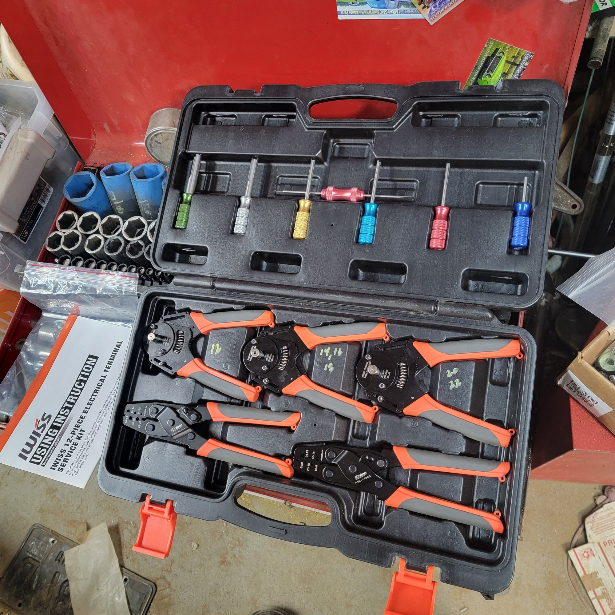 This is the  IWISS 12-piece electrical terminal service kit # KIT- DC01. 3 round pin 4-way crimpers and 2 for the folded pins like the PCM connector.