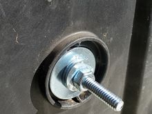 Fender washer, four regular flat washers, and a nut, locktite on the nut.