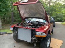 Just a few hours of locating plugs, I forgot to plug in the oil pressure switch, fuel vent solenoid, and crank position sensor and it fired up! Let it idle an hour and burped the coolant. Took her for a spin and topped everything off. Now to get it registered and inspected (Maryland, ugh ):