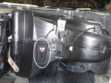 The evaporator probe door behind the glove box gives access to the front of the evaporator coil