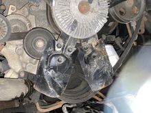 Lower left fan blade pushed in, hitting hose.