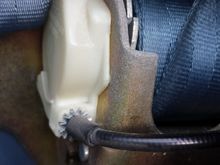 This is the housing on the side of the retractor where the cable from the switch enters.