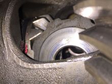 The washer seems like it should match up to the chamfer on the gear