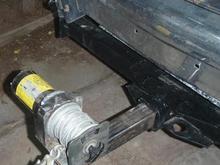 Old winch mounted on reciver hitch.