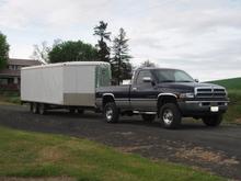 that snowmobile trailer weighs 3600 empty, but I played tetris and CRAMMED FULL of ALL my sisters stuff in there because she is moving so I'm guessing it weighs in excess of 6000, its pretty tongue heavy...and she's barely squatting...thanks add a leaf!