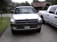 and heres my baby from the front with my stepmoms megacab next to it