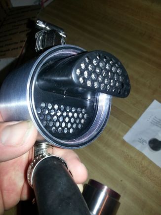 catch can oil separator insert w/ o-ring holding it inlace.  Best to start the o-ring behind the protruding part and work it into the o-ring shoulder where your finger can help guide it in.