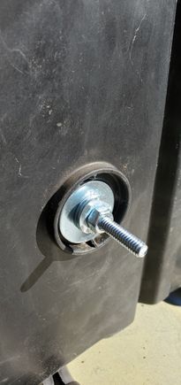 Fender washer, four regular flat washers, and a nut, locktite on the nut.