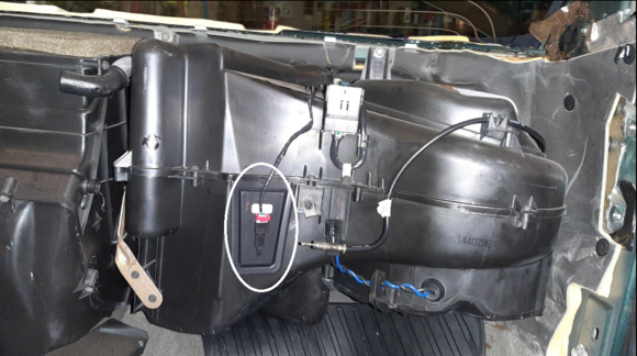 The evaporator probe door behind the glove box gives access to the front of the evaporator coil