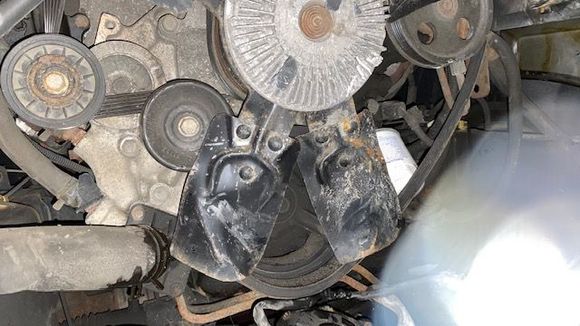 Lower left fan blade pushed in, hitting hose.