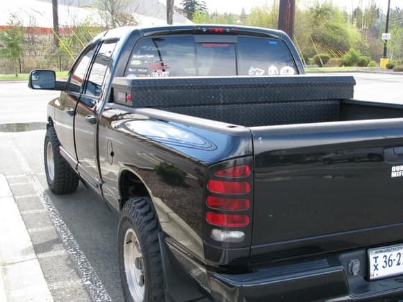 Back shot with blacked out tailight covers, weatherguard toolbox, tow mirrors, and my stickers :D