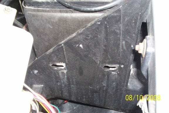 this is the side of the battery box where the two prongs of the fuse box slide into