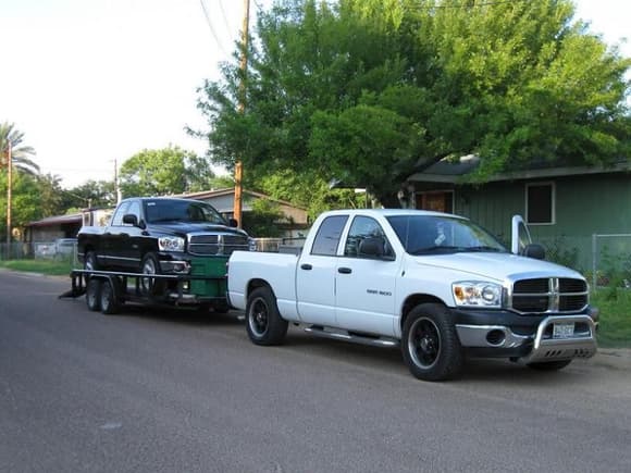 My truck towing my father-in-law's truck.....