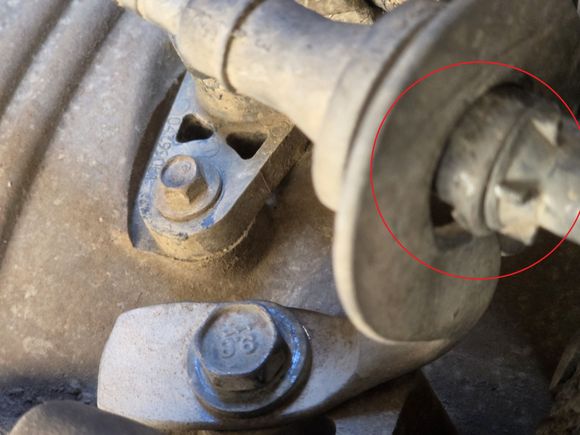 Trans cable pulled thru bracket w/o clamp