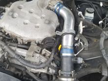 The stock intake was dry rotted when i got it, so i replaced it with a garbage tube i found on ebay. The filter it came with ended up falling apart, so i got this one from autozone. Yes, that is a hurricane strap holding the tube in place. Lots of ghetto work done, but ive done it all myself (with help of some friends). 
