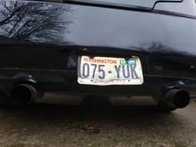 Exhaust and bent license plate