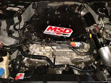 Injen sp series CAI Reimagined with carbon fiber wrap, 3” 45’ elbow to 4” down pipe to K&N 3.5” dry air filter mounted long way across lower bumper vent! 
Motordyne 5/16 spacer, TB coolant delete hose! Heat resistant painted oem TB.. custom steel plate to separate  electrical wiring harness from engine heat and minimize any unnecessary electrical issues, and create cleaner engine bay look! 13 pound radiator safety release cap! Amazon baffled oil catchcan!