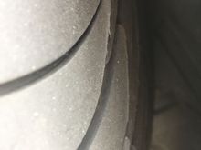 Shot of the rear side of the tire, outer edge. Looks like the trailing edges of the tread are lifted up.