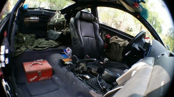 So I needed a simple cup holder and console. this old Milwaukee power tool box fits snug in place and the stock removable Infiniti cup holder fits in it perfectly. Tested tonight, works great, but it is temporary until I can fabricate a new console over the airbag sensor. In my Jeep I used a heavy gauge military surplus  ammo box, but I want something lower for this setup. I'm not leaving that tool box there, and I expect I'll have a passenger seat again in the near future..