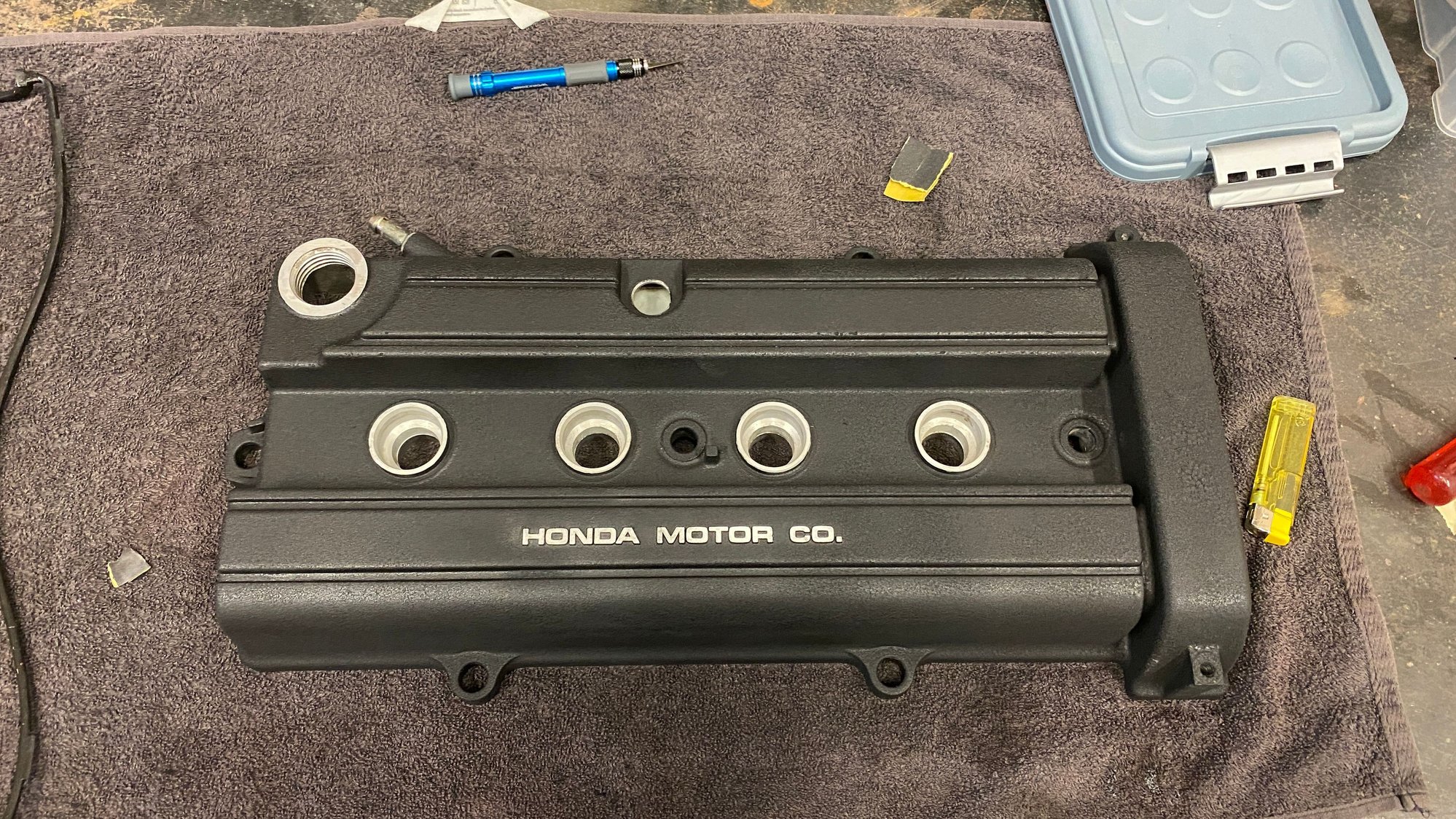 repainted after careful sandblasting and thorough cleaning of trapped sand underneath the cover