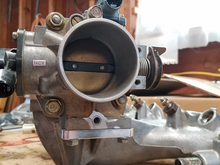 Here is the block-off plate installed.  I just cut off the nipple where the coolant hose went into the TB to clean up the look since I wasn't using it anymore.  I just removed the lower portion of the IACV (not pictured) where the coolant ports attached.