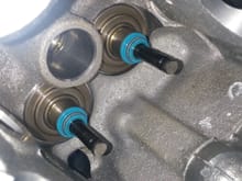 Removed the valve springs from a head i bought and noticed these two seals on the exhaust side are not fully on so i tried pressing them on with a valve seal tool , but they wont go into place. Should i jus replace all valve seals ?