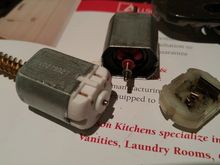 Install carbon brushes (rubber cap) from new unit into old motor