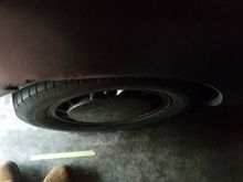 Passenger side, top of the wheel sticks out as much as the flare on the body