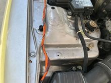 cut up harness on the car, any idea why its orange?