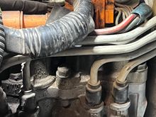 To me it looks like some sort of brake reservoir 