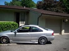Starr 17" rims (chrome section) 2 inch drop with some side skirt from a body kit.