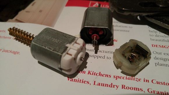 Install carbon brushes (rubber cap) from new unit into old motor