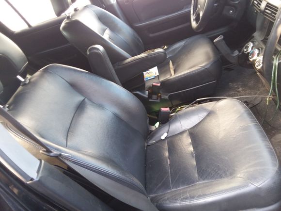 The driver seat does have a rip and the arm rest is worn out