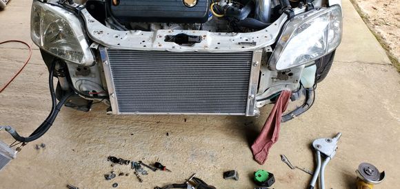 Fits great! Had to trim some of the radiator support on the civic to allow the inlet and outlet to fit.

 
