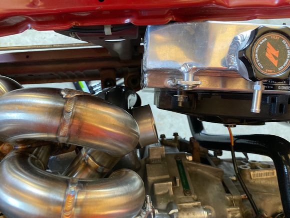 My only solution I can think of is to cut off stock radiator mounts, a drop the radiator down and slide it as far as I can to the passenger side, I bought asr relocation mounts but I don’t even know if that would be enough, seems like I’ll still have to angle the radiator, so maybe make like a skid plate out of 1/8 stainless and mount to it???? People have had to have bought this manifold and ran into this issue